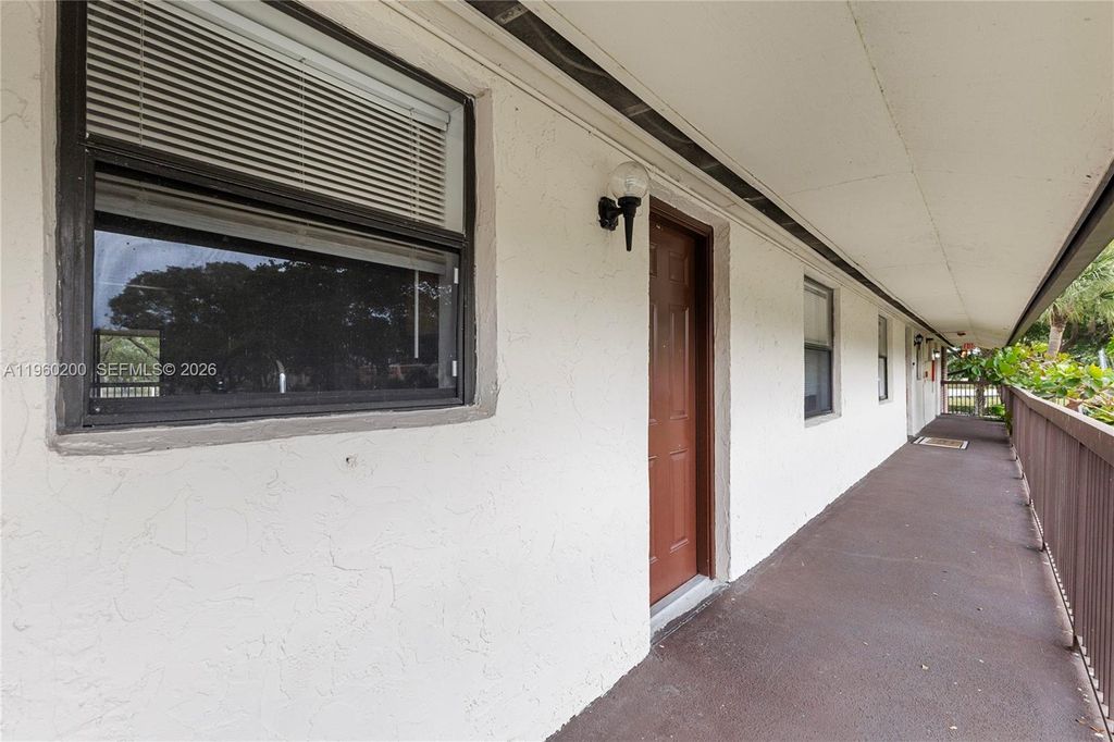 Photo of 6061 Shakerwood Cir #206, Tamarac, FL 33319 (MLS # A11960200)