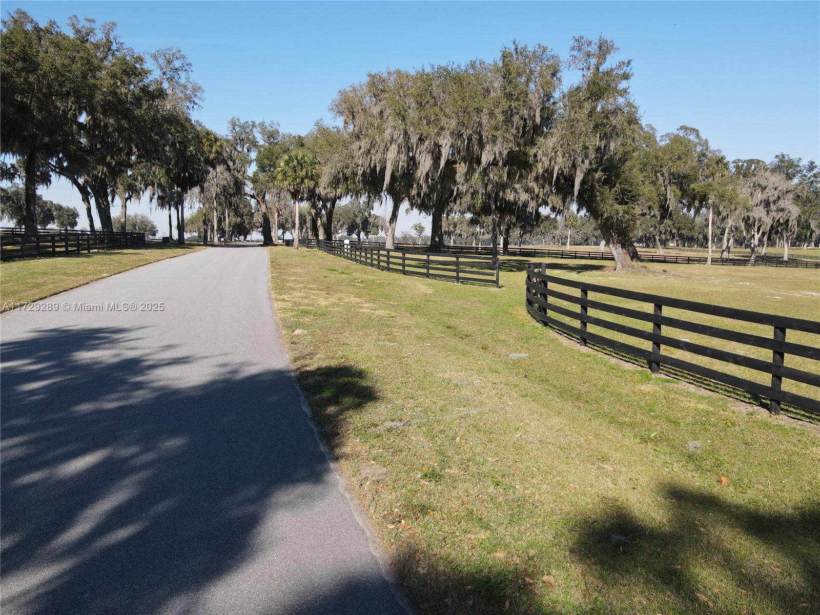 Potential owner Contract with approx 30% DN and balance 8% 20 years. This prime acreage is ideal for equestrian enthusiasts, offering plenty of space to build your dream horse estate. Imagine riding through the shade of mature oak canopies, soaking in the natural beauty of this extraordinary property. Whether you’re envisioning a custom-built home or a private barn for your horses, this slice of paradise offers endless possibilities. Located in a sought-after horse community, this rare gem combines natural beauty with an equestrian lifestyle, making it the perfect sanctuary for you and your equine companions. Power to the property line approximatly 15 feet away from the already installed well. this property shares 1/3 ownership in prestine 5 acre lake. Owner is licensed Realtor