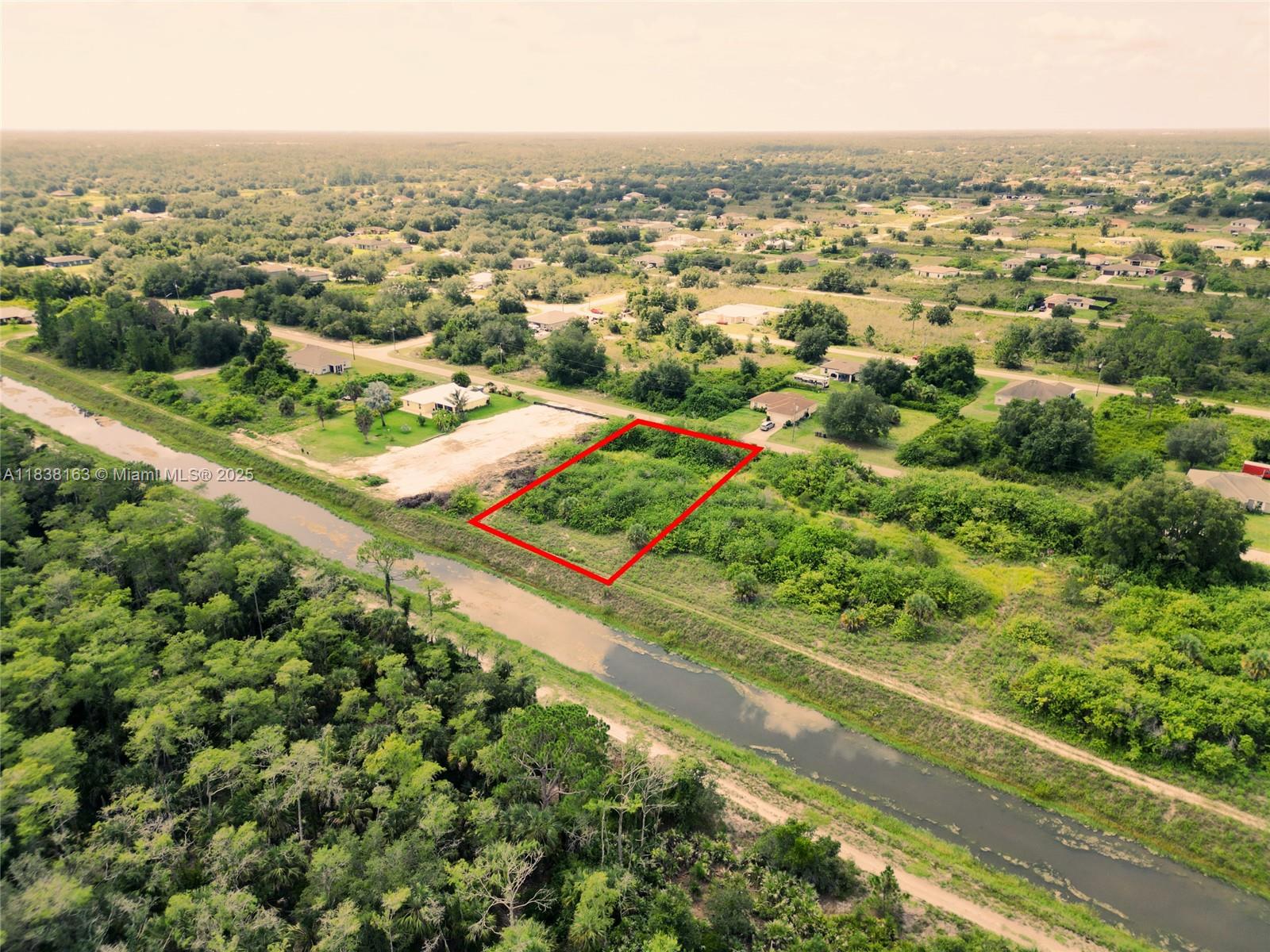 Here is an oversize lot that backs up on a wide canal.