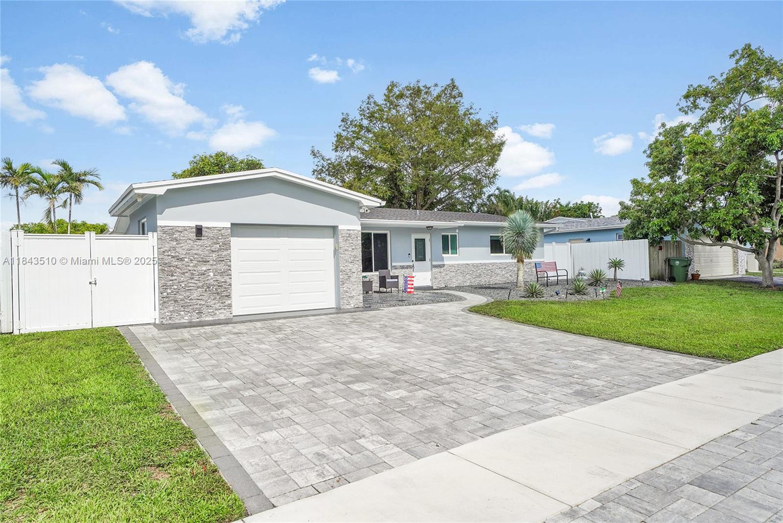 Absolutely stunning, fully remodeled 3/2 single-family home in sought-after Pembroke Pines—with NO HOA! Just minutes from Pembroke Lakes Mall and CB Smith Park, this nearly brand-new home offers a new shingle roof (2020), screened-in pool with gas heater, travertine patio, and modern curb appeal. Upgrades include impact windows, new flooring, fully renovated kitchen with granite counters, backsplash, three refrigerators, and all TVs included! New garage door, opener, security cameras, dura fence, oversized paver driveway, impact front door, new A/C, and washer/dryer. Pavers wrap around the home, and both bathrooms feature new vanities. Move-in ready!