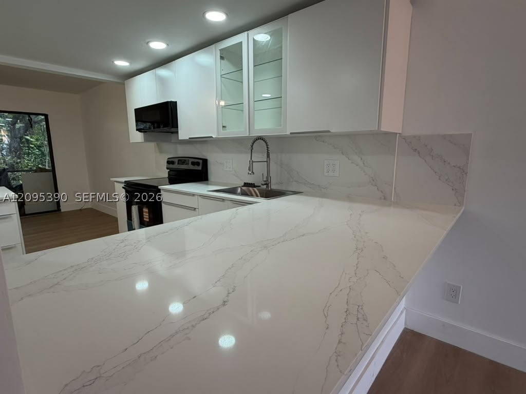 Photo of 639 N University Dr #17, Plantation, FL 33324 (MLS # A12095390)
