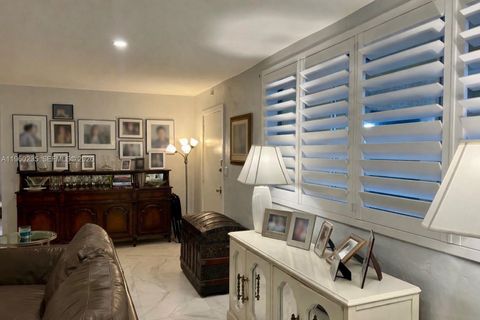 Photo of 11960 NE 19th Dr #15, North Miami, FL 33181 (MLS # A11960235)