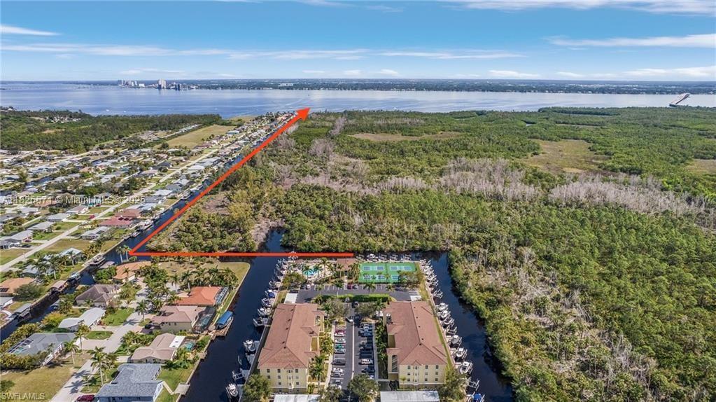Boater’s paradise! This beautiful 3BR/2BA first-floor condo in Island Cove features a brand-new 10,000 lb boat lift & dock with direct Gulf access—no bridges! Enjoy peaceful preserve views, a spacious 1,330 sq ft layout, & resort-style amenities just steps away, including a heated pool, spa, tennis, & pickleball. The owner’s suite offers canal views, dual closets, & a stunning walk-in shower. The kitchen boasts stainless steel appliances, pantry, & stylish accents. Relax on your screened lanai or launch your boat in minutes, thanks to the nearby dock & community ice machine. Updates include new appliances 2020, dock & lift 2024, lanai screens 2025, & impact windows/doors. Pet-friendly, quiet, & move-in ready—don’t miss the virtual tour! Seller is offering a 1% rate buy down, saving you $!