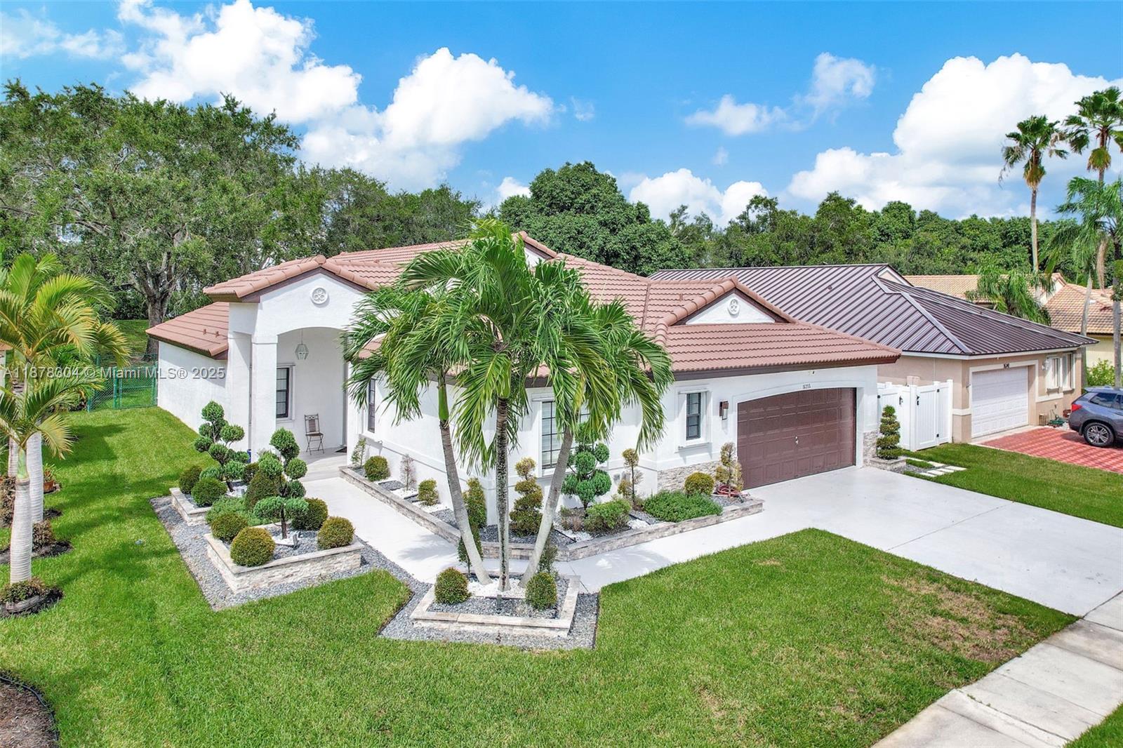 Exceptional living awaits in this beautifully renovated 4-bedroom, 2-bath home in the highly desirable, gated community of Pembroke Shores. Modern kitchen, updated baths, and an open layout full of natural light, complemented by high ceilings that enhance the spacious feel. The primary suite opens directly to the backyard—perfect for indoor/outdoor living. Low HOA $497.09 quarterly. Conveniently located just minutes from I-75 and Turnpike, top schools, shopping, and dining. This home combines luxury and convenience in one elegant package. Homes like this are rare—schedule your private showing today!