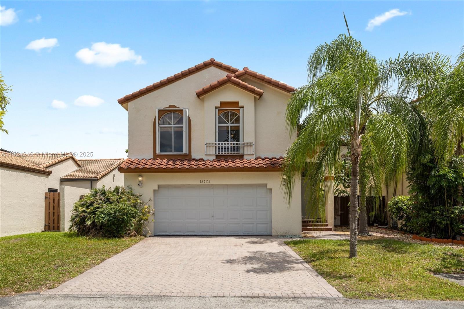 Welcome to this charming 4-bedroom, 2.5-bath home nestled in a quiet Kendall neighborhood. Featuring soaring vaulted ceilings in the living room, this property offers a bright and open feel from the moment you enter. The grand master bedroom includes a spacious en-suite bathroom, perfect for relaxing after a long day. While the home could use a little TLC, it presents an incredible opportunity to make it your own. With great bones and plenty of space, this home is full of potential for the right buyer or investor. Don't miss out on this hidden gem! It's priced to sell!