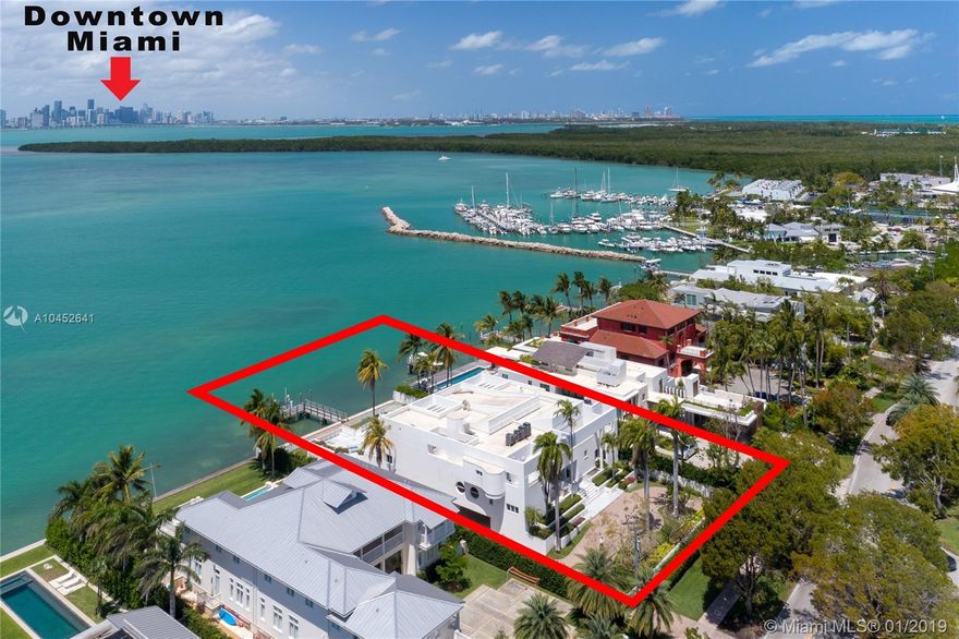 Enjoy unobstructed views of Downtown Miami & Biscayne Bay from tropical Key Biscayne. Situated on the best street on the Island, the 3-story modern home was built strong with 2 floors of beautifully finished living space plus ground floor with 5-car garage, staff room, & generous storage space. Finished with marble floors, the living areas consist of formal entry foyer, entertainment bar, living room, family room, eat-in kitchen with breakfast area, formal dining, & office. Two beds on the first floor, 4 beds including master on the second. Other features include: walnut floors & doors, marble baths, access to roof top, utility room. Master bed with private terrace, 4 closets, & marble bath. Outside, expansive pool deck, large pool, spa, dock. Experience Island living like-no-other.