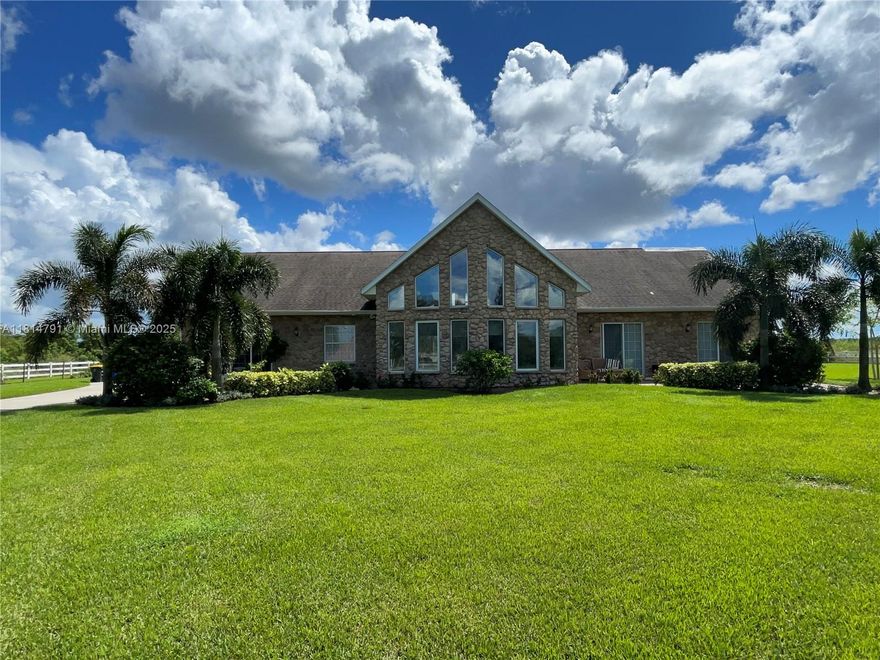 Discover your dream homestead on 5 fully fenced, ag-zoned acres! This unique property offers a spacious 4-bed, 2.5-bath home with a 2-car garage and everything you need for modern country living. The massive 66x30 steel barn (2022) features a brand-new 5-ton A/C (2024). Bring your animals—there’s a chicken coop, animal barn, and stalls already in place! Enjoy fresh fruit from your own starfruit, plantain, grape, and fig trees. Relax in the large above-ground pool or entertain on the newly screened-in back patio (2024). Plus, a 4-inch well and upgraded water filtration system (2024) ensure you're set up for self-sufficient living. Roof 2017,Two welcoming front porches complete the charm. Rare find—don't miss it!