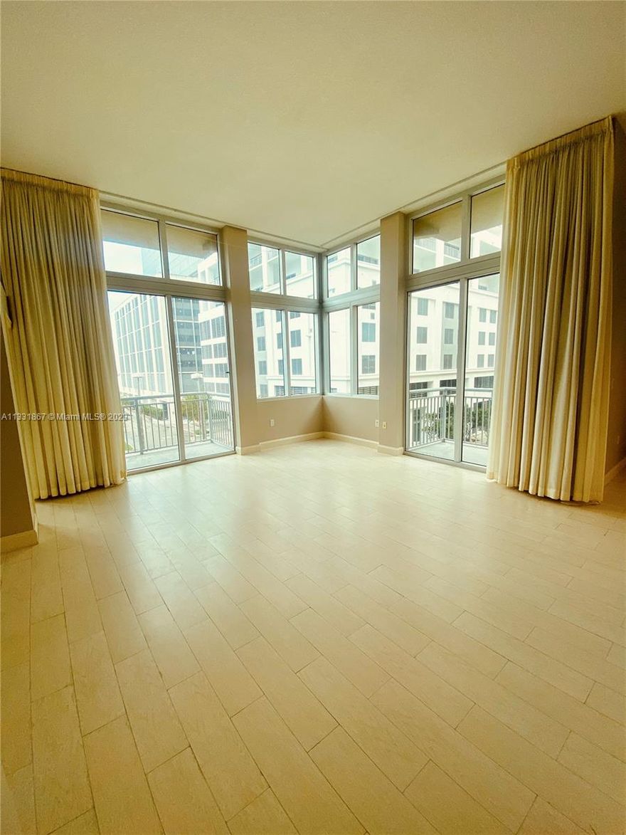 Stunning large 1 bed/1bath corner loft w/ 13'ceilings & expansive view, in prestigious Metropolis Tower at
Dadeland, 1 block from Publix & the Metrorail. Airy, bright & cheerful, this unit boasts off- white porcelain tile
flooring laid to look like wood. Enclosed bedroom with French door, California closet, granite counter tops with S.S.
appliances & large den/dining area. Unit has custom made neutral color drapes from floor to ceiling, neutral colors
throughout washer & dryer combo, 2 balconies. Basic cable/internet included. 1 assigned parking space.