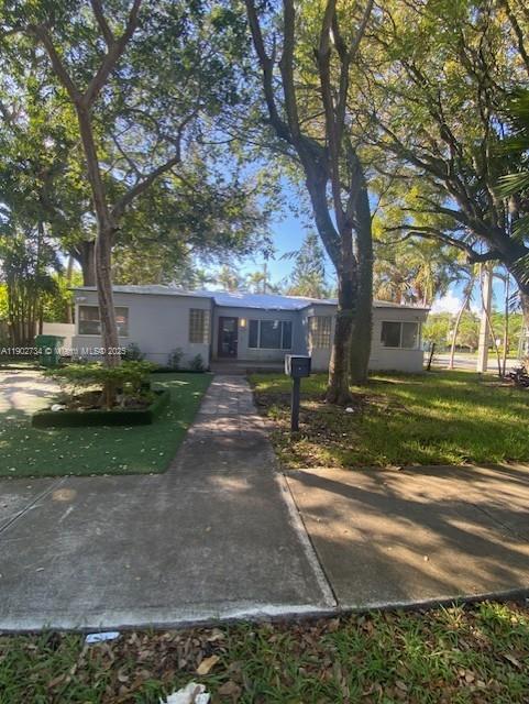 The Design District is just a few steps away from this house, nestled in a quiet area to relax and work. Enjoy Miami in a neighborhood renowned for its historic homes and proximity to world-class brands. Innovators, artists, will find world top brands as well as upscale home goods, fashion, and accessories. This fully renovated home features 4 bedrooms, 2 bathrooms, a social area with an open layout, and two doors to exit to the patio. Everything is new—windows, kitchen, bathrooms, roof, flooring, and fixtures. The area boasts an extraordinary food scene. Miami’s fashion, design, and arts, while living and working in a peaceful setting,