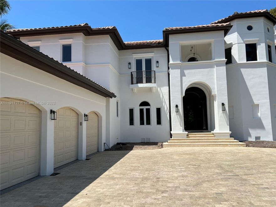 Turnkey newly renovated Islands of Cocoplum Ramon Pacheco home.