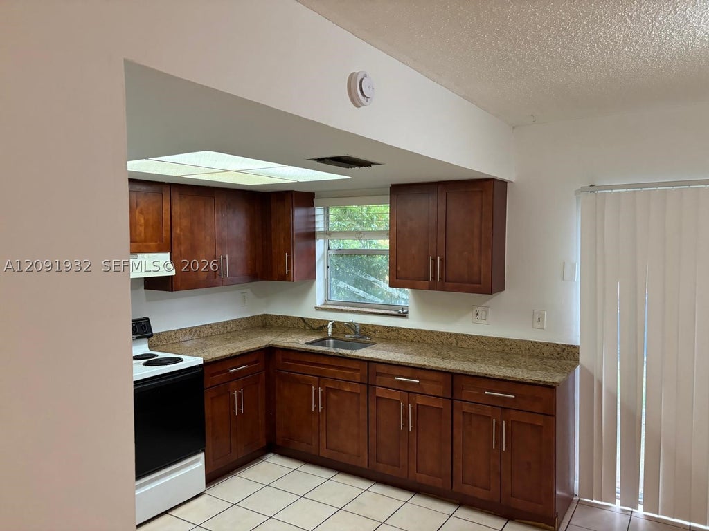 Photo of 2510 NW 52nd Ave #22A, Lauderhill, FL 33313 (MLS # A12091932)