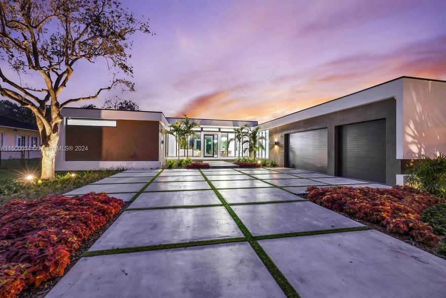 This contemporary masterpiece in Glenvar Heights graces a spacious 33,977 sqft corner lot, situated on a tranquil cul-de-sac—creating an ideal haven for families with kids. The exceptional property comprises 6 bedrooms & 6.5 bathrooms in the main residence, featuring a detached VIP Suite for guests, a stylish pool, & a 3-car garage.Throughout, top-notch craftsmanship is evident in the exceptional Miacuccina finishes that embellish interior doors, kitchen, closets & vanities.The floors boast stunning 24*48 sandstone silk porcelain tiles, & the kitchen radiates sophistication with Calacata Alabaster Quartz countertops, complemented by high-end Thermador & Bosch appliances, including a 92-bottle wine fridge.Other perks: generator ready, electric blackout curtains, & an outdoor summer kitchen.