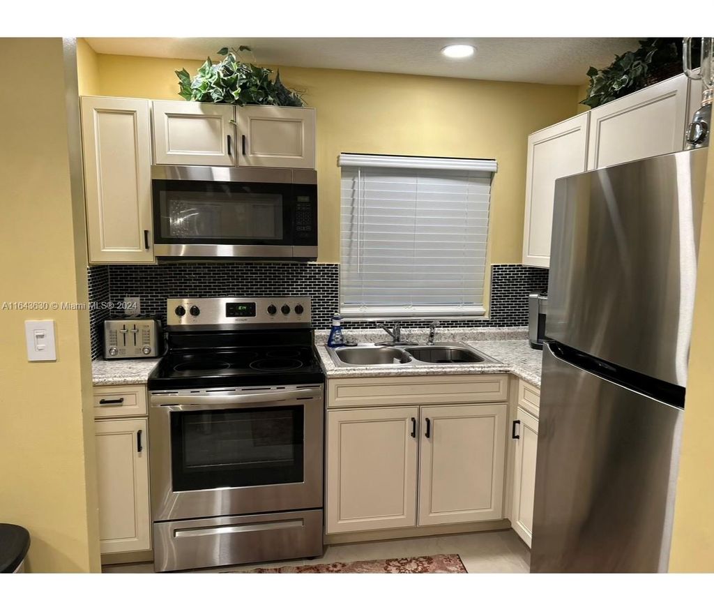 Photo of 238 Palmetto Dr #2, Lake Park, FL 33403 (MLS # A11643630)