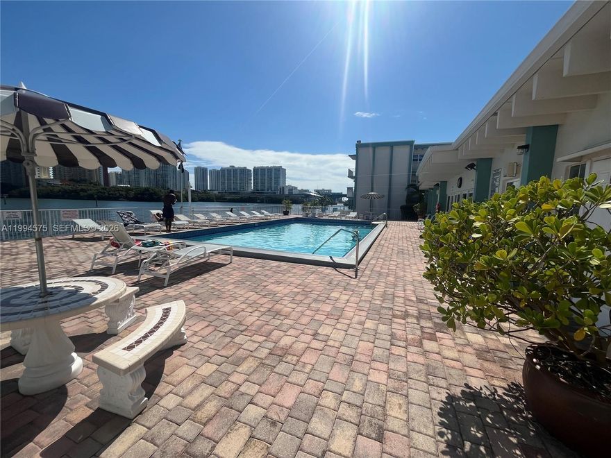 Beautiful and spacious 1-bedroom, 1-bath condo with a spectacular private terrace overlooking the canal, the Intracoastal, and the city skyline. Located in the desirable and peaceful community of Eastern Shores, this residence offers comfort, a great layout, and plenty of natural light throughout.

Just minutes from Sunny Isles Beach, the beach, and some of the best restaurants and shopping in the area. The building offers great amenities, including a beautiful pool and clubhouse with bay views. Please schedule appointments through Showing Assist.