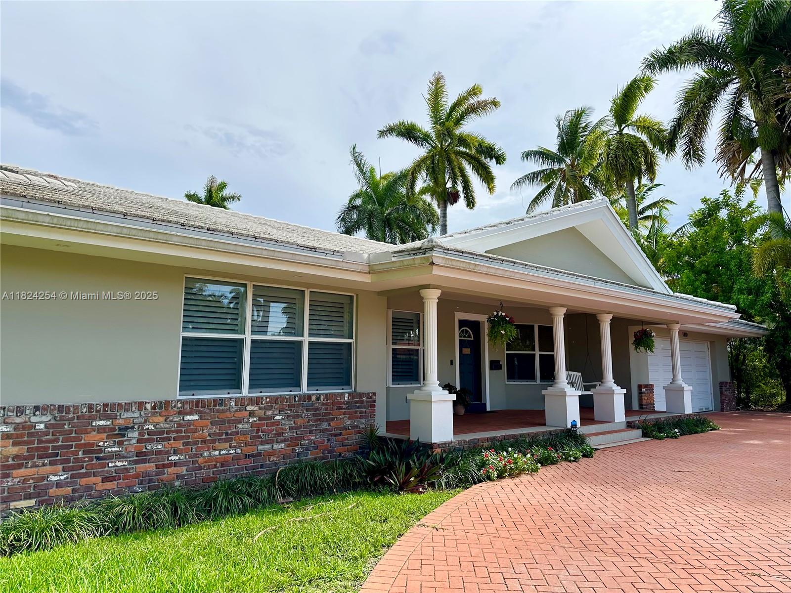 This home has it all!! Beautifully renovated with high-end finishes - 3BD/3BA home on a rare double lot with pool and huge 2-car garage located on historic Harrison St. Custom modern kitchen, Wolf gas cooktop, double wall oven, wine cooler, and Carrera Fantasy quartz. Designer finished Lime-washed walls in main living areas. The massive primary suite boasts an x-large sitting area, luxurious bathroom, and two incredibly large custom walk-in closets. Window treatments include plantation shutters through-out, electric blackout shades bedrooms. Impact windows & doors throughout. Enjoy the large Tiki Hut by the pool, ideal for entertaining. Pool child fence & equipment included. 2 zone A/C, 2 tankless water heaters, 2016 roof, 10’ garage ceilings, and EV outlet. This home is a must see!!