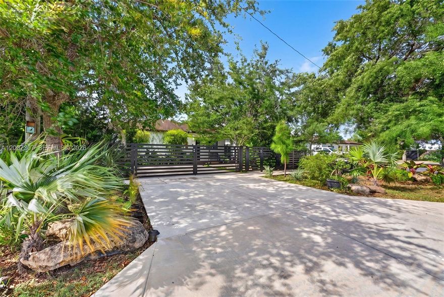 Private Compound with Work-from-Home Infrastructure
This exceptional single-family estate offers a comprehensive living solution on a fully fenced, tree-lined lot. The Main residence consists of 3 bedrooms and 1 full bath, Newly Updated Kitchen, bathrooms , Impact Windows, and custom  integrated wall units to use as a professional home office & Extra storage.  The 1-bedroom, 1-bathroom in-law quarters with seperate entrance has income potential OR  for multi-generational living.  This a private enclave with native foliage, parking for 4 vehicles, and a generous yard for future pool or to expand the footprint.  This home has approved plans to expand its current square footage & can be provided at Buyers Request.