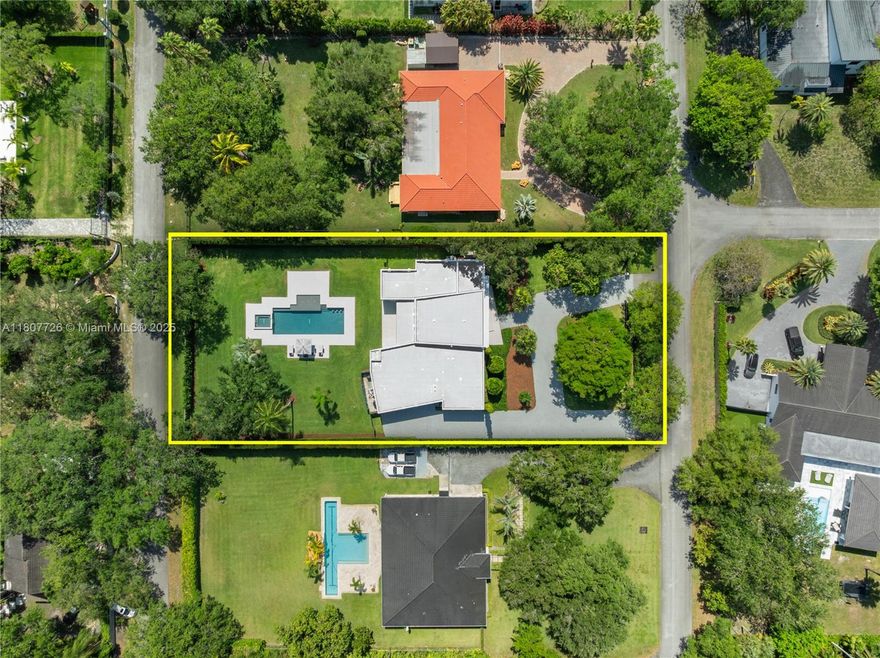 A 2020 architectural marvel, this home sits on a builder’s acre near Baptist Hospital. Grand pivot door, soaring ceilings, Poggenpohl kitchen with Wolf, Sub-Zero & Miele appliances, butler’s pantry, and wet bar. Savant smart home with JL Audio, media room, office, and Kohler whole-house generator. Spa-style primary suite with boutique closet and floating tub. This residence features an open-concept layout that seamlessly connects formal living, dining, and family spaces—perfect for both daily living and entertaining. Outdoors: saltwater heated pool/spa, tanning ledge, covered patio, and 3-car garage with Bi-Park lifts and EV charger. A rare fusion of design, comfort, and innovation—tour today.