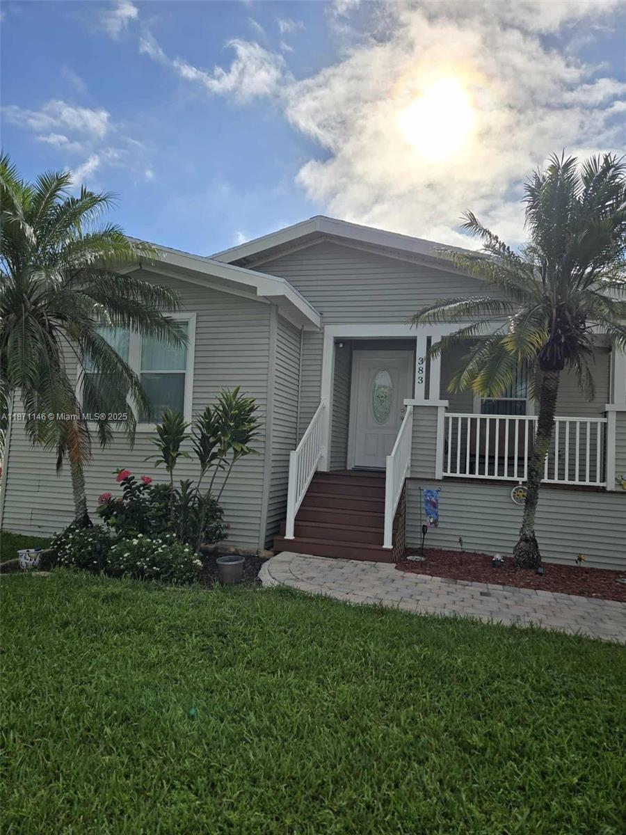 Welcome to your new home in a beautifully maintained gated community! This spacious mobile home offers 3 comfortable bedrooms 2 baths. HOME on the Water Brand New roof , FRONT porch, Side pouch , and Back Porch. seeking a cozy yet roomy space. Enjoy access to a wide range of community amenities including a sparkling pool, laundry area, tennis court, exercise room, and BBQ area—ideal for relaxation and socializing. Water is included in the lot rent, and financing is available, making homeownership more accessible than ever. Manufactured home is located in a 55+ community so 1 person has to be over 55 to apply. Don't miss out on this opportunity to live in a secure and vibrant community. Schedule your tour today!