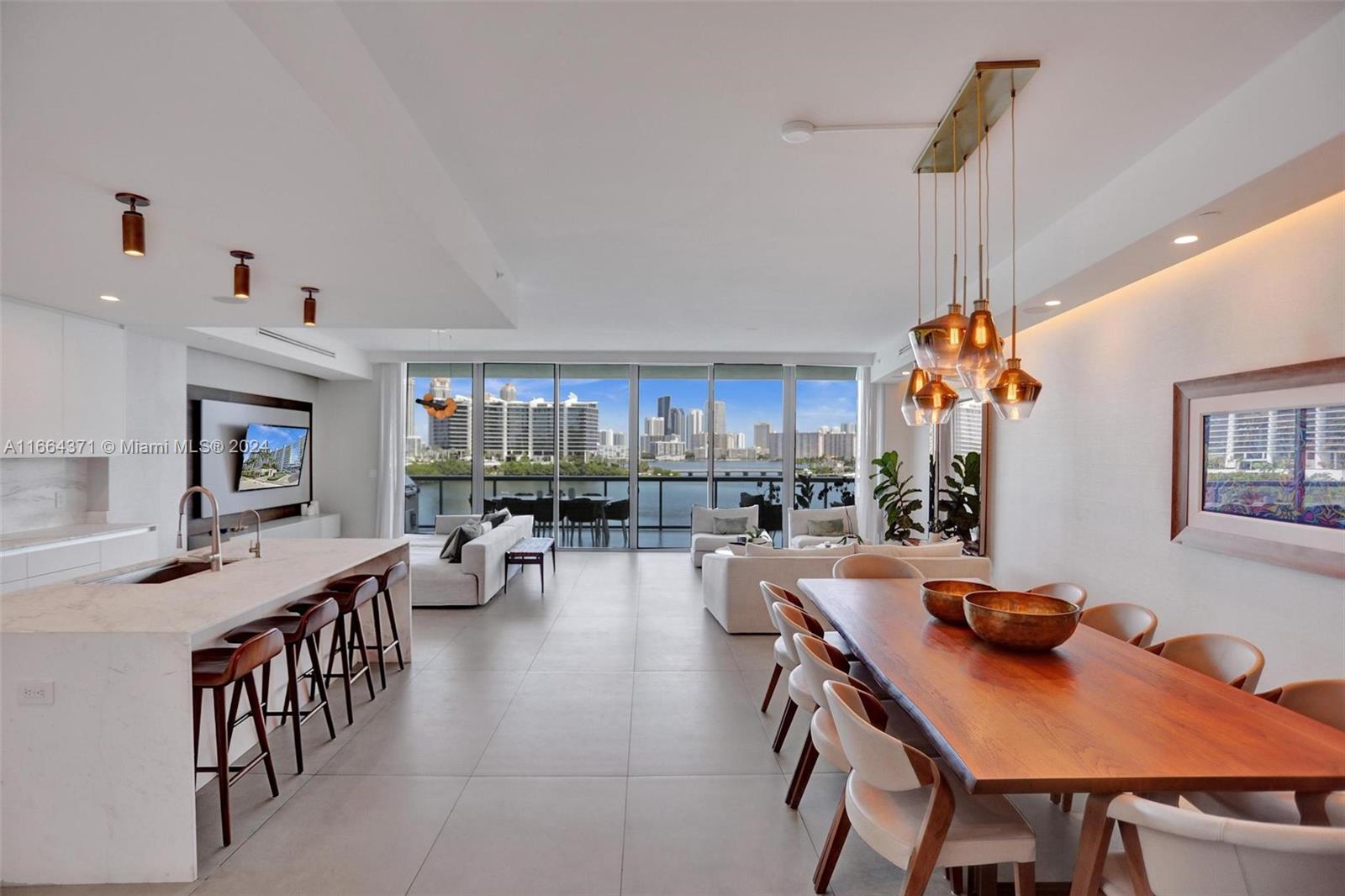 Experience modern luxury in this fully renovated Echo Aventura residence, boasting stunning water & city views. With abundant natural light streaming through floor-to-ceiling windows, this 3-bedroom + den, 4.5-bathroom home features a private foyer with direct elevator access, built-in closets, and electric blinds in every room. Enjoy smart home technology with Control4.The open kitchen showcases marble countertops, a Wolf gas stove, Sub-Zero appliances, and sleek Italian cabinets, complemented by a summer kitchen on the balcony—perfect for entertaining. New laundry/service area & 2 dedicated parking spaces. Residents can indulge in top-tier amenities, including a state-of-the-art gym, infinity pool with bay views, valet parking & concierge service.
This is luxury living at its finest!
