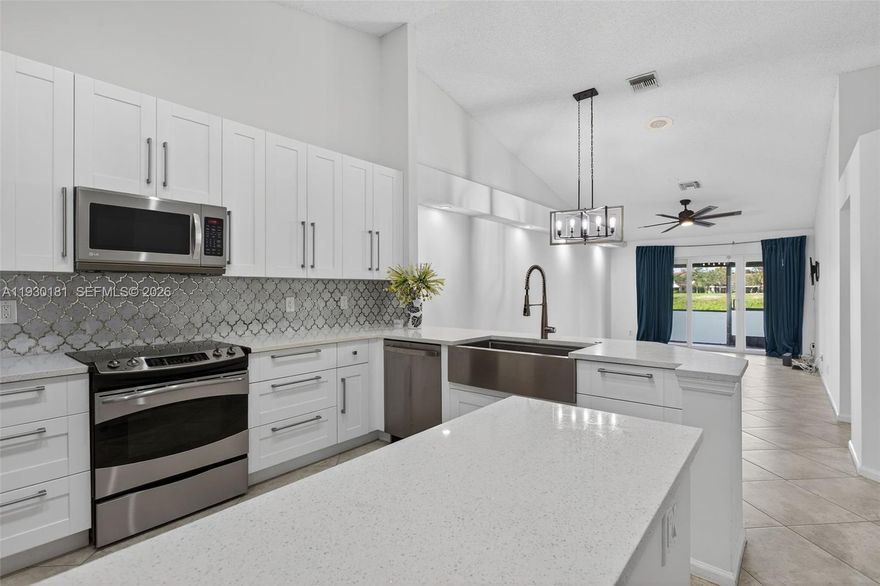 Welcome home to this stunning immaculate updated two bedroom two bathroom villa! HOA fee Covers Insurnace, you just need a condo policy. Featuring Impact Windows and Sliders | Hurricane Rated Skylight | New High-end Light Fixtures and LED Recessed Lights | Classic White Shaker Open Kitchen | Quartz Countertops | Laminate & Timeless Tile Flooring | High Ceilings | Split Bedroom Open Floor Plan | Primary Suite Closet Built-ins | Epoxy Garage Floor | Built in Garage Storage | Newer Water Heater | Newer AC Unit | Brand New Dishwasher | Freshly Painter Full House Interior and HOA To Paint Exterior In 2026 | Screen Enclosed Patio | Paved Expanded Patio | Prime location with Tranquil Backyard Water Views to be further Upgraded with elevated green space to Come with the New Lakes of Carolina Project! HOA fee includes Exterior Insurance! Pet friendly up to one 40 lb pet. Community offers recently update pool, community room you can rent for events and gym! Do not miss this one!