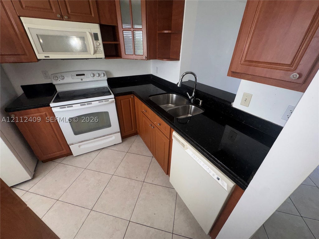 Photo of 8740 N Sherman Cir #406, Miramar, FL 33025 (MLS # A12112409)