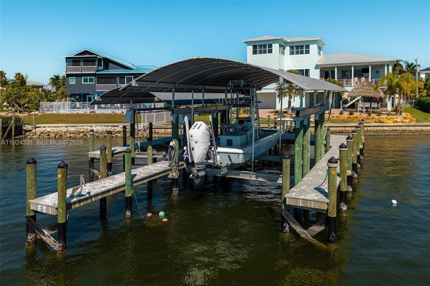 Experience luxury waterfront living in this fully renovated 3-bed, 3.5-bath San Carlos Bay estate with unobstructed deep-water Gulf-access views. Located on the southern tip of Pine Island in St. James City, it offers a peaceful Old Florida lifestyle minutes from Cape Coral and Fort Myers. Over $400K in upgrades include a new roof, spray-foam insulation, hurricane impact windows/doors, new HVAC systems, instant hot water, and a full-home generator. Boaters will love the premium dock with 6k and 15k lb lifts and no-bridge Gulf access. Outdoor amenities include a heated pool/spa, Tiki Hut, and full outdoor kitchen. Inside features high-end renovations, wide-plank tile, custom closets, and a chef’s kitchen with Jenn-Air appliances, exotic granite, and $250K in custom cabinetry. Offered tastefully furnished, plus an oversized 4-car epoxy-floor garage. A rare blend of security, luxury, and prime Pine Island waterfront living.