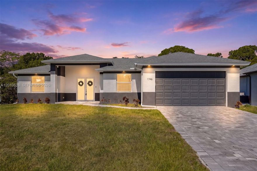 Just like new and ideally positioned in one of Cape Coral’s most desirable communities near Coral Lakes Golf Course, this luxury pool home offers a perfect blend of privacy, modern design, and Southwest Florida living. Surrounded by beautifully maintained estate homes, some backing to the golf course, the property makes a strong impression with its inviting entry, modern lighting, and elegant double doors. Inside, a spacious open floorplan with great room design is ideal for entertaining, with expansive sliders from the living and dining areas creating seamless indoor-outdoor flow to the lanai and pool. The custom kitchen features a striking waterfall countertop, upgraded finishes, and a clean, modern look. The primary suite offers generous space, a large walk-in closet, and a spa-like bath, while the split-bedroom layout provides privacy for guests with two bedrooms in their own wing. A versatile den with double doors works perfectly as a home office, flex space, or potential fourth bedroom. Outside, enjoy an oversized lanai with a custom pool and spa, plus a full outdoor kitchen with built-in grill, burner, sink, and mini fridge. The expansive patio overlooks a peaceful wooded backdrop owned by the City for the golf course, adding privacy and natural views. With impact windows and doors, energy efficiency, and a prime location on one of the community’s best streets just a short walk to golf, this home truly checks every box for Florida luxury​​‌​​​​‌​‌​​​‌‌​​​‌‌‌​​‌​​‌‌​​​​ living.