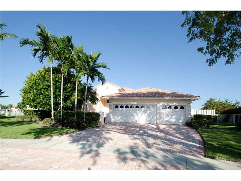 One-of-a kind waterfront, pool home with panoramic water views! Spacious 4/3 features pavered driveway and patio, three-car garage, ceramic tile and wood floors, recessed lighting, formal dining room, eat-in kitchen, high ceilings and so much more. Bar is not included. If interested, can be negotiated separately. Make us an offer today!
