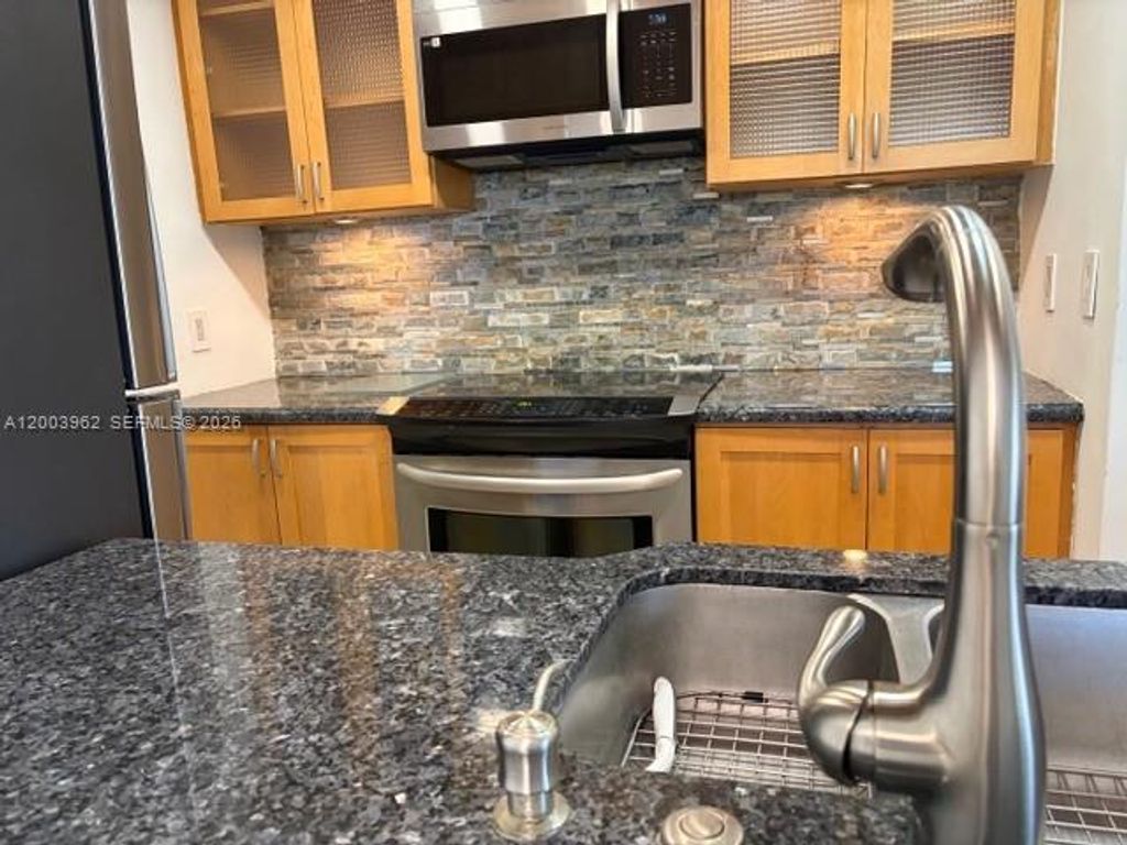 Photo of 1407 NE 56th St #301, Fort Lauderdale, FL 33334 (MLS # A12003962)