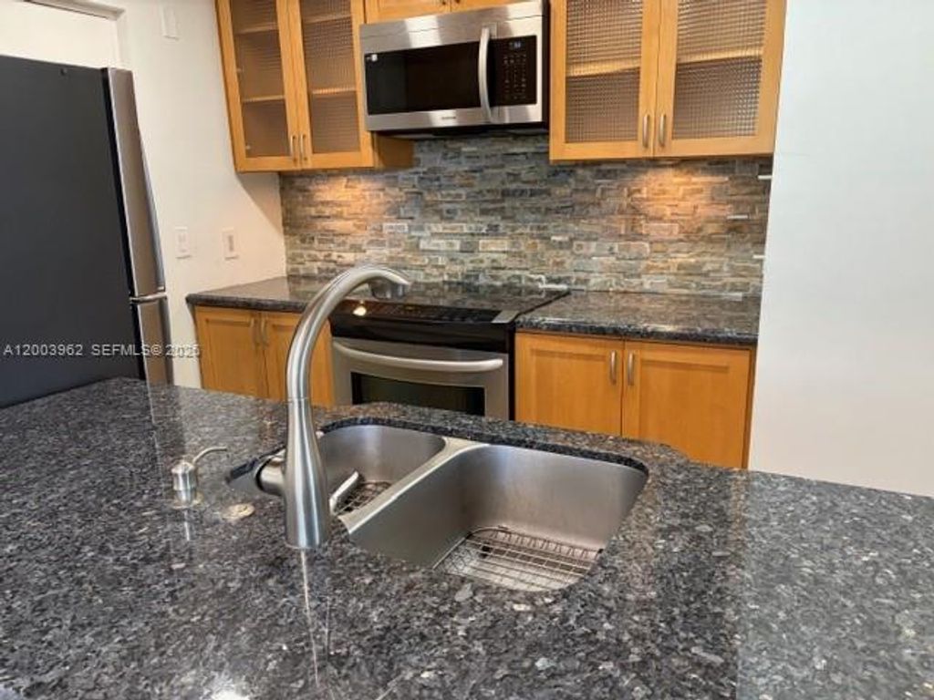 Photo of 1407 NE 56th St #301, Fort Lauderdale, FL 33334 (MLS # A12003962)