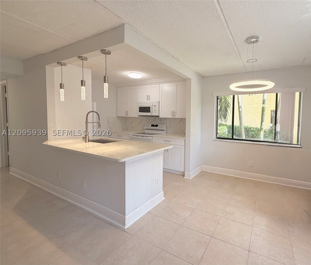 Photo of 110 Meadows Cir #110, Boynton Beach, FL 33436 (MLS # A12095939)