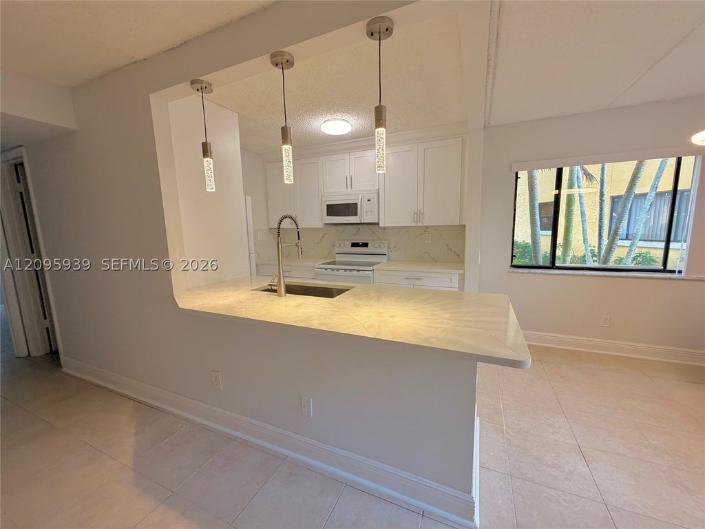 Photo of 110 Meadows Cir #110, Boynton Beach, FL 33436 (MLS # A12095939)