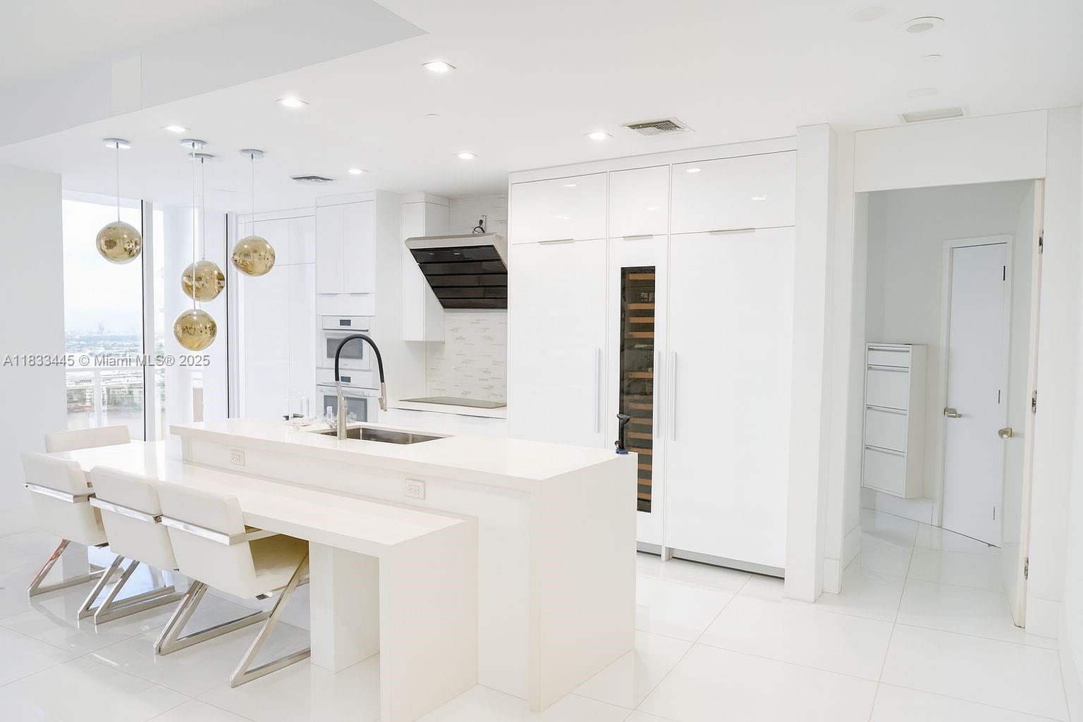 Embrace modern simplicity in this elegantly renovated residence at Carbonell. Located on a high floor, it offers unobstructed views of the Miami River, Intracoastal, and skyline through floor-to-ceiling windows. The all-white interior feels airy and refined, with a sleek custom kitchen, reimagined closets, and built-ins that blend seamlessly into the space. Every detail is subtle and intentional, creating a calm, gallery-like atmosphere. A perfect balance of light, space, and design.