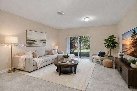 Photo of 4403 Woodland Cir, Tamarac, FL 33319 (MLS # A11973100)