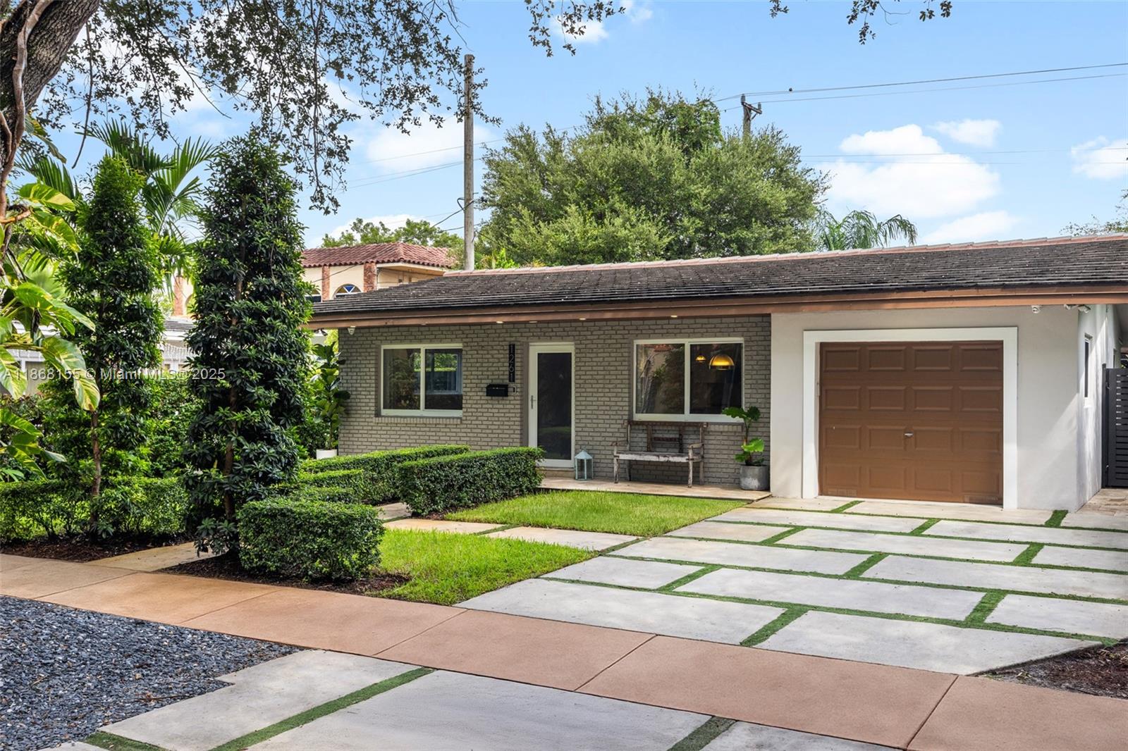 Beautifully renovated 3 bedroom, 2 bathroom home in Coral Gables. This modern home features an open concept kitchen with a farmhouse sink, quartz countertops and stainless steel appliances. Enjoy added comforts like impact windows and doors, plantation shutters, and an artificial fireplace. Step into the primary bathroom featuring a walk in shower with a rainfall shower head. Relax in the backyard oasis equipped with an aluminum gazebo, TV and seating area. Perfectly blending style and convenience, this home is a true gem in a sought-after location.
