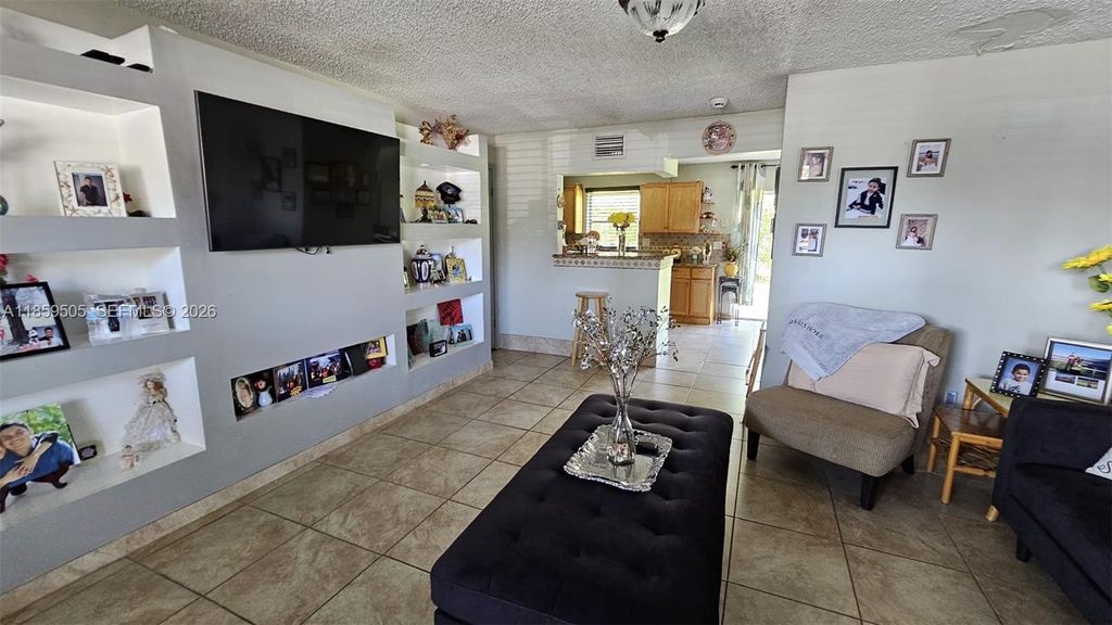 Photo of 7501 Kimberly Blvd #104, North Lauderdale, FL 33068 (MLS # A11859505)