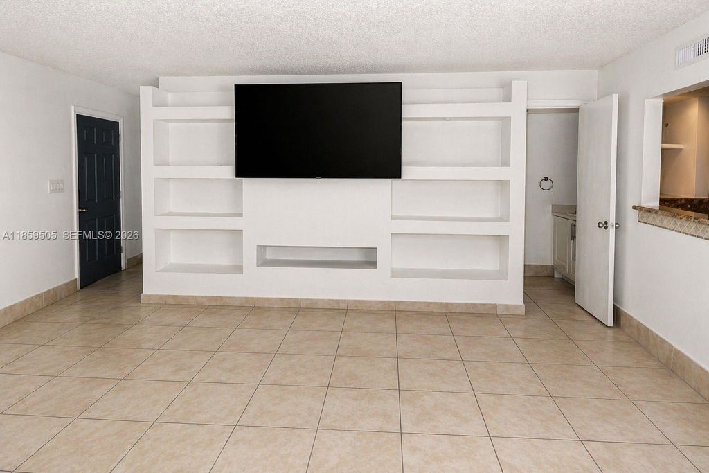 Photo of 7501 Kimberly Blvd #104, North Lauderdale, FL 33068 (MLS # A11859505)