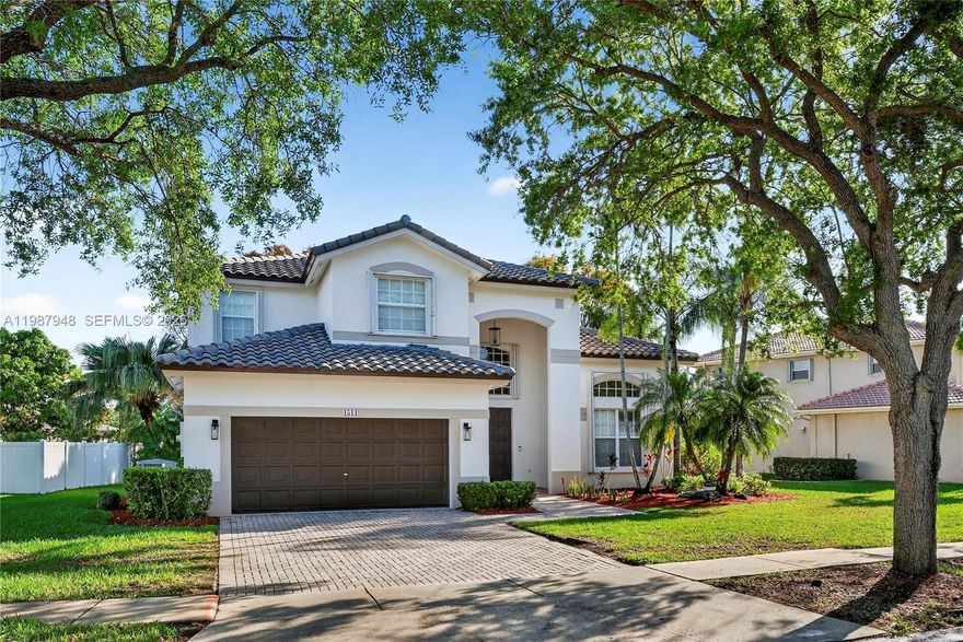 THE JEWEL OF PEMBROKE ISLES . Prepare to be captivated from the moment you step inside. This stunning 4-bedroom, 2.5-bath residence boasts a rare architectural elegance with a breathtaking second-floor gallery view looking down into the expansive, sun-drenched living areas. Fully turnkey and future-proofed, this home features a NEW ROOF (2023), NEW AC (2023), and NEW WATER HEATER (2025). The first-floor Master Suite is a private sanctuary, featuring a 2025 designer remodel with high-end finishes. Modern 2024 waterproof vinyl flooring flows throughout, complemented by custom-made closets and fresh, contemporary paint. Enjoy the ultimate resort lifestyle in a 24-hour guard-gated community with A+ schools and unrivaled amenities (3 pools, gym, tennis, and more). Your dream home is ready to experience the absolute "WOW" factor once you walk in!