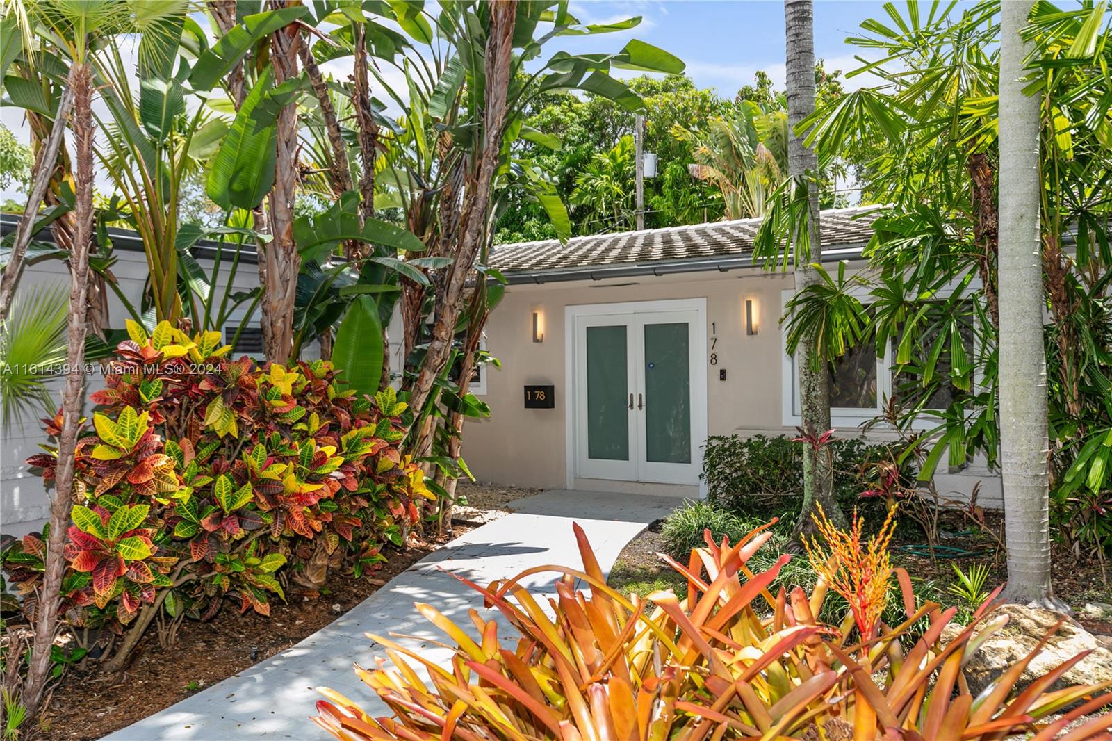 Located within the prestigious Bay Heights enclave, this extensively renovated residence embodies the essence of Miami living.This spacious & luminous home features 4 bedrooms & 3.5 baths, showcasing a rare blend of modernity & tropical charm. Renovations include a newer roof, impact glass windows, flooring, remodeled bathrooms, among other enhancements.The kitchen is equipped with Monogram appliances, including dual dishwashers, an induction stove, & Miele wine refrigerator.The expansive family room, accentuated by wood beam ceilings, seamlessly integrates with the open living & dining areas, offering picturesque views of the meticulously landscaped backyard and inviting pool. Security is assured with 24/7 police patrol, providing privacy & peace of mind in this exclusive community.