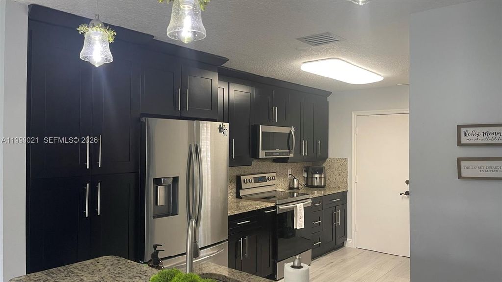 Photo of 10138 Royal Palm Blvd #401-4, Coral Springs, FL 33065 (MLS # A11999021)