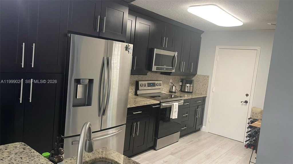 Photo of 10138 Royal Palm Blvd #401-4, Coral Springs, FL 33065 (MLS # A11999021)