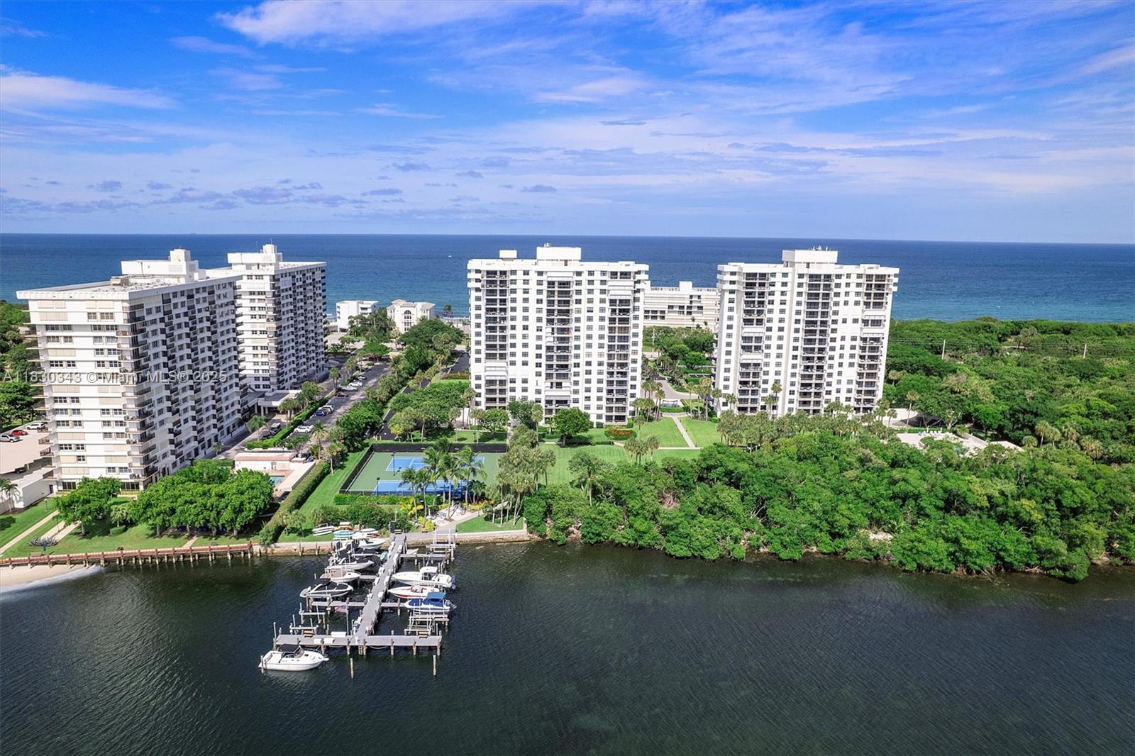 Stunning corner unit with ocean & Intracoastal views! Enjoy sunrises/sunsets from dual balconies. Features updated kitchen with quartz counters, renovated baths, impact windows, motorized shades, custom walk-in closet, tile & laminate floors. Resort-style amenities: pool, gym, dock and tennis. 40-year milestone complete. Luxury coastal living at its best!