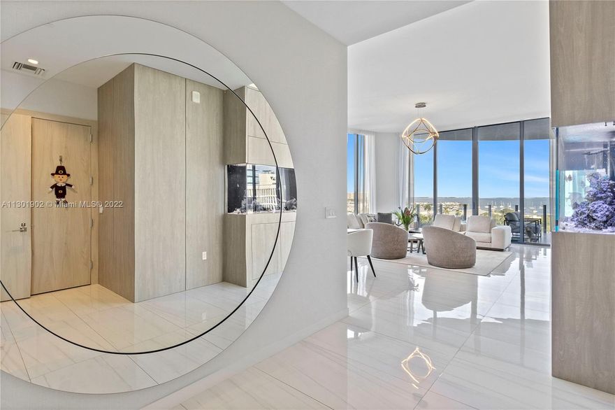 Smart home with amazing views of the Bay as well as the pool areas. 8D is the jewel of One Park Grove the most coveted waterfront tower in Coconut Grove, 12 foot ceilings are just the start of this one of a kind residence, linear diffusers, solid wood doors, kitchen waterfall island, Ornare Closets, custom built-in the living area showcasing the 85 inch TV, custom built in 7 ft long Aquarium. Custom built in Family Room/office. 6'X8' foot Storage, 2 Premium assigned parking. 5 Acres w/80,000 SQ Ft of lush green space, and 50,000 SQ Ft of amenities. Interior and exterior SQ Footage as per developer's floor plan which are available.