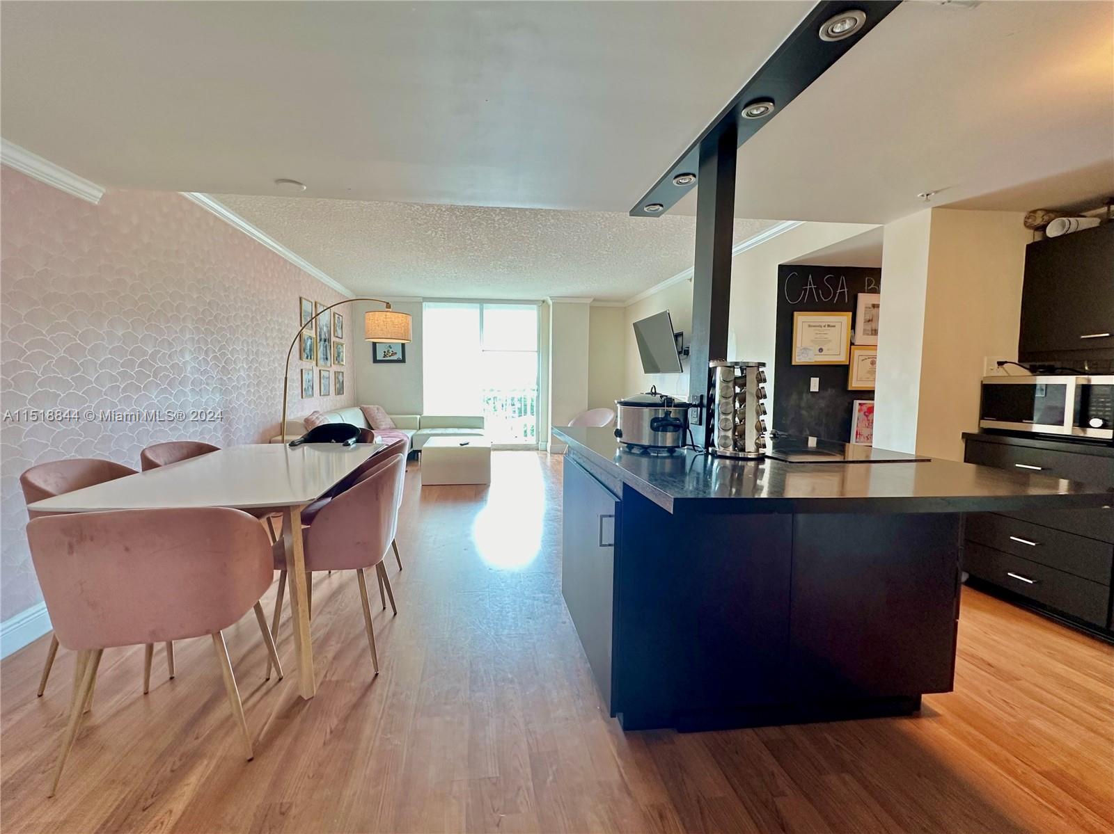 Welcome to The Aston, a pristine condo tower nestled between Coral Gables and Brickell, on the beautiful tree-lined Coral Way. This wonderful unit features a custom open-concept kitchen overlooking the ample dining and living spaces. Enjoy beautiful open city and pool area views from your private balcony. The large master suite features a deep walk-in closet, ensuite bath, and private balcony access. The amenities include a gorgeous pool, lounging area, gas barbecue grill, a nicely equipped fitness center, and 24-hr front desk attendant. Notable features include in-unit washer/dryer and impact windows. Walking distance to dining and shopping! Internet included.