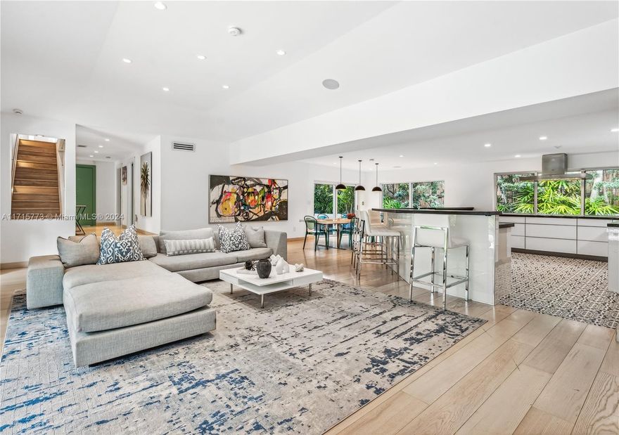 This beautifully remodeled 5-bedroom, 4.5-bathroom home, with a bonus  maid's quarters, offers nearly 4,000 SF of sophisticated living space. Updated in 2017, it boasts high-end finishes throughout, including white oak floors, a chef’s kitchen with Gaggenau appliances, marble countertops, and an induction cooktop.
The home is perfect for entertaining, with a heated saltwater pool, surround sound speakers both indoors and outdoors, a beautiful bbq area in the back  
The first floor features 2 bedrooms and 1.5 baths, while the second floor includes a spacious primary suite, walk-in closet, and 2 additional bedrooms. 
With a 2-car garage, a gated driveway, impact windows, security cameras, and a prime location on exclusive N Bay!