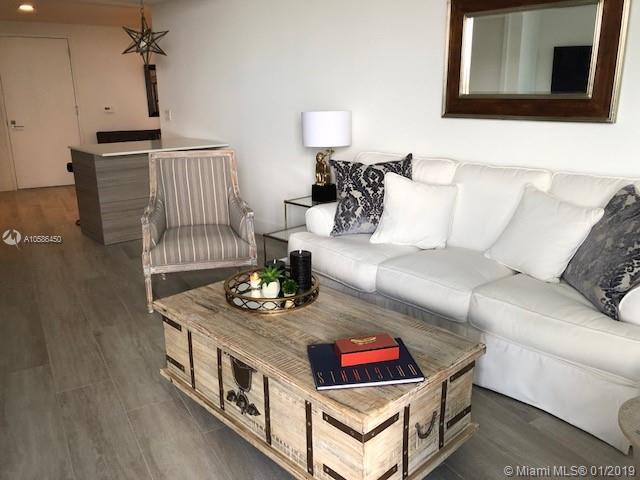 Live in a brand new apartment with design like furnishings. Turn key unit which includes a convenient cooking island, large flat screen TV's and a separate den. Enjoy wonderful sunsets from your furnished balcony. Must see to appreciate this tastefully decorated space. Live in the oasis of Hyde Midtown and enjoy resort style living in the middle of this trendy up and coming neighborhood. Custom closet, window treatments and owned upgrades throughout.