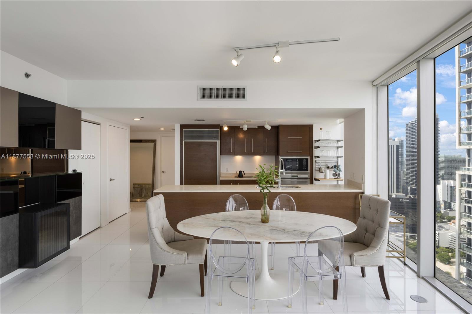 Experience elevated living at the Icon in this fully furnished 2-bedroom, 2-bathroom corner residence with sweeping views of the Miami River and skyline. Floor-to-ceiling windows flood the home with natural light, while a chef’s kitchen with Sub-Zero & Wolf appliances, premium cookware, and a built-in bar makes entertaining effortless. Smartly designed for modern living, the unit features a 65” TV, Sonos surround sound, Hue lighting, Nest thermostat, gig-speed internet, standing desk, Herman Miller chair, and dual monitors. The primary suite offers a Casper king mattress, blackout shades, and a true walk-in closet. Residents enjoy world-class amenities including a spa, state-of-the-art fitness center, Olympic-size pool with cabanas and service, private movie theater, and on-site dining.