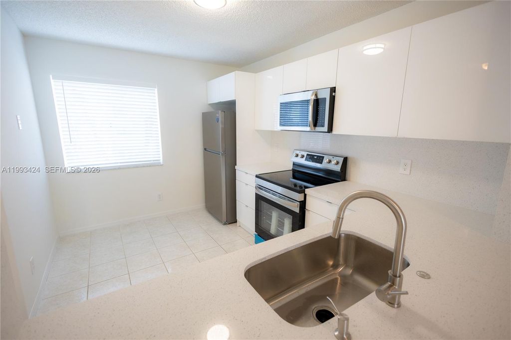 Photo of 719 NW 208th Way #719, Pembroke Pines, FL 33029 (MLS # A11993424)