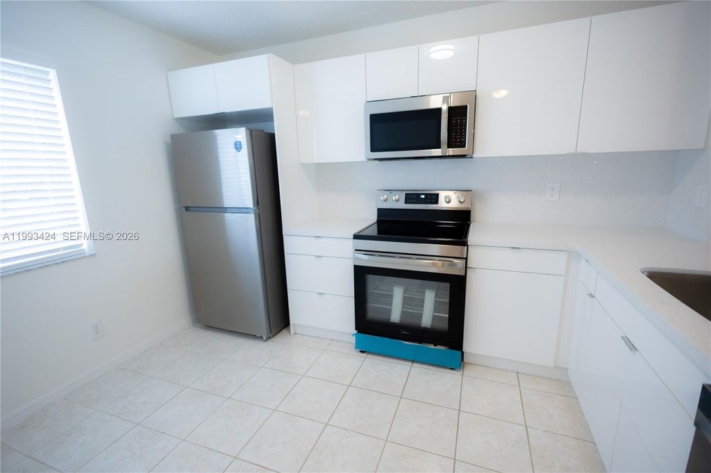 Photo of 719 NW 208th Way #719, Pembroke Pines, FL 33029 (MLS # A11993424)