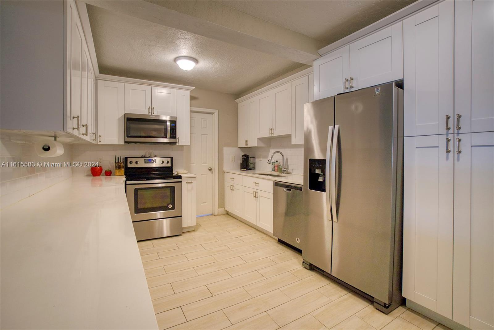 HURRY! THIS HOUSE WONT LAST! A charming Fort Lauderdale home just down the street from vibrant Las Olas, a couple miles from Fort Lauderdale Beach and 4 miles from the Fort Lauderdale Airport! This exquisitely renovated property boasts a spacious upgraded kitchen with stunning quartz countertops, a bonus/flex room for an office or home gym, elegant wood-look tile on all floors, beautifully updated bathrooms, and a brand new AC (2024). A roomy shed (2020) and concrete pavers/turf were installed in the backyard (2023). Sellers have a flawless 4-point inspection from 2022. No HOA, so you can Airbnb and rent without restrictions! Don't miss this opportunity for convenient city living in a freshly updated home!